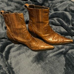 Steve Madden pointed toe brown leather ankle booties.